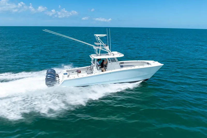  Yacht Photos Pics 2018 Freeman 37VH boat cruising on open ocean under clear blue sky.