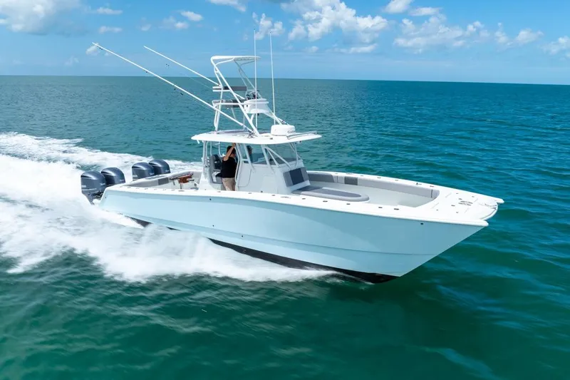  Yacht Photos Pics 2018 Freeman 37VH boat cruising on open ocean under clear blue sky.