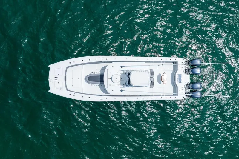  Yacht Photos Pics Aerial view of 2018 Freeman 37VH boat on turquoise water.