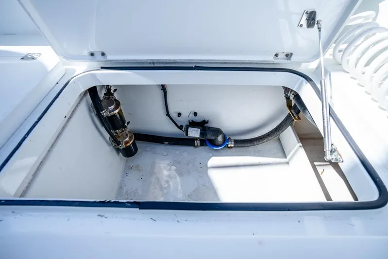  Yacht Photos Pics Open storage compartment in 2018 Freeman 37VH boat, showing internal components and wiring.