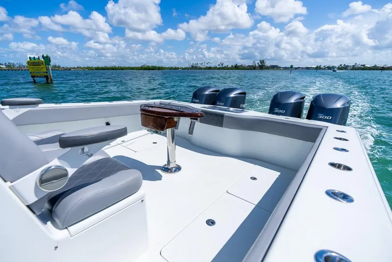  Yacht Photos Pics 2018 Freeman 37VH boat with quad engines on open water under blue sky.