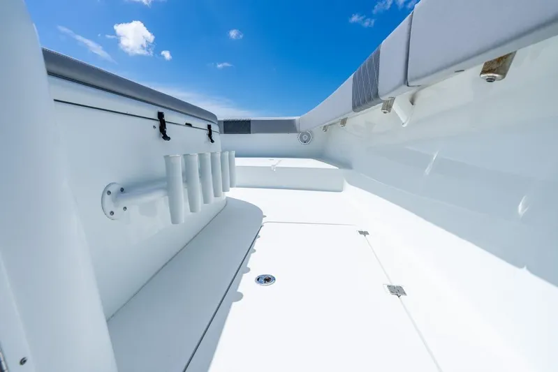  Yacht Photos Pics 2018 Freeman 37VH boat interior with rod holders under a clear blue sky.