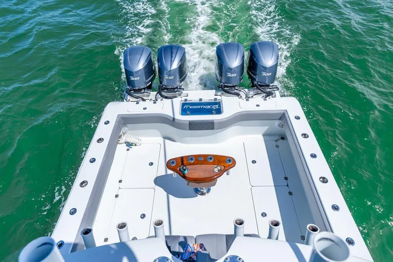  Yacht Photos Pics Freeman 37VH 2018 boat with four powerful engines cruising on green water.