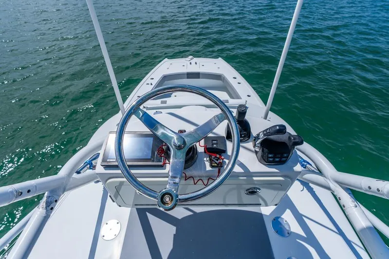 Yacht Photos Pics Steering console of a 2018 Freeman 37VH boat on open water.
