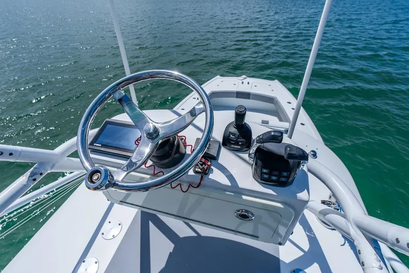  Yacht Photos Pics 2018 Freeman 37VH boat helm with steering wheel and controls on open water.