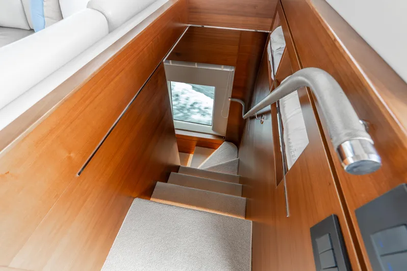 Mamu Yacht Photos Pics Staircase inside 2018 Princess F-68 yacht with wooden finish and modern design.