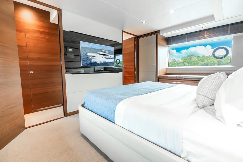 Mamu Yacht Photos Pics Luxurious bedroom interior of 2018 Princess F-68 yacht with modern decor and scenic window view.