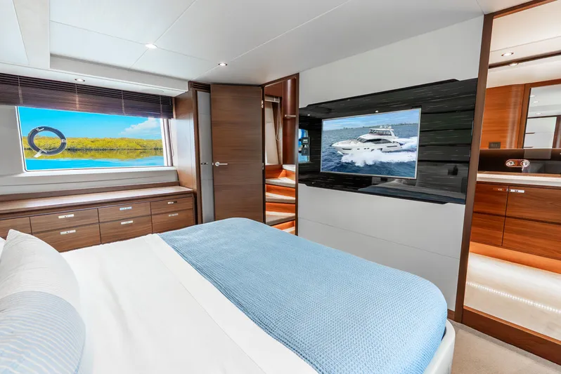 Mamu Yacht Photos Pics Luxurious 2018 Princess F-68 yacht bedroom with modern decor and scenic window view.