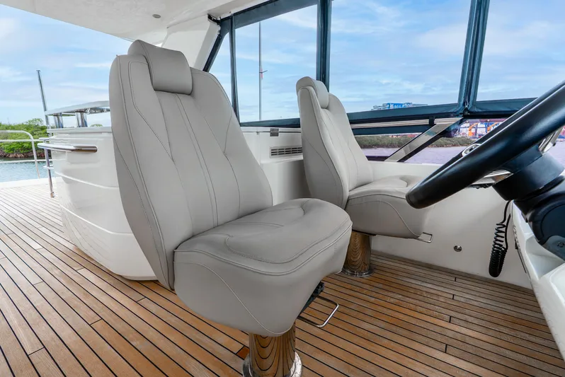 Mamu Yacht Photos Pics Luxurious interior of 2018 Princess F-68 yacht with plush seating and wooden flooring.