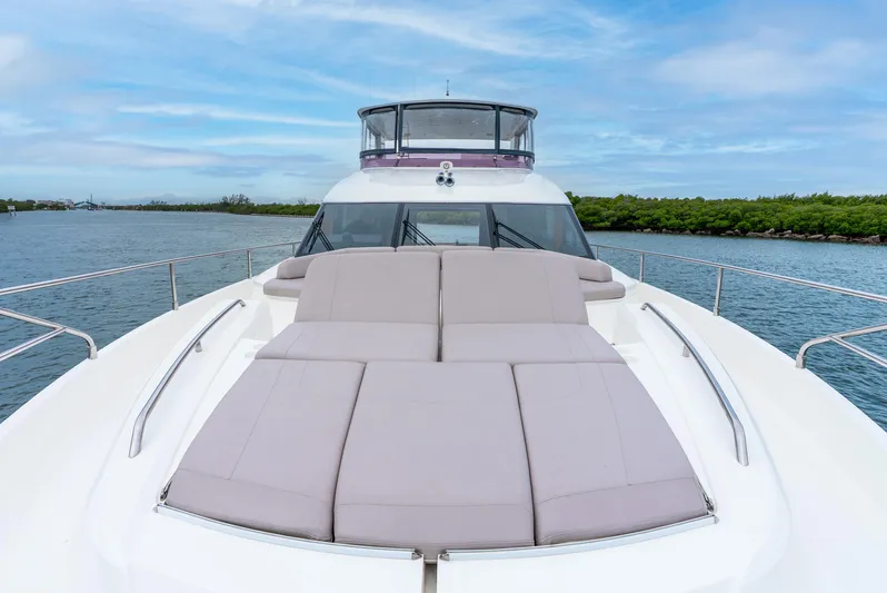 Mamu Yacht Photos Pics Luxury Princess F-68 yacht deck with sun loungers, 2018 model, on serene water.