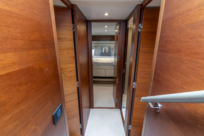 Mamu Yacht Photos Pics Luxurious hallway inside 2018 Princess F-68 yacht, featuring wooden doors and modern design.