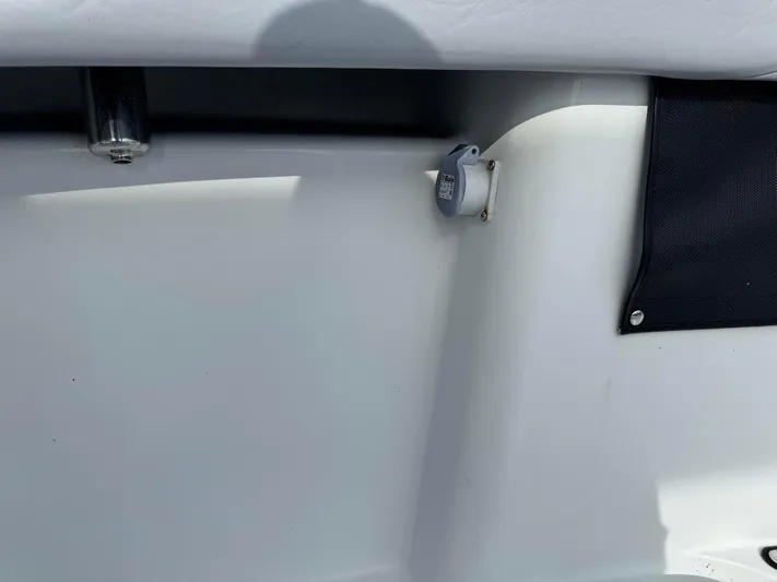  Yacht Photos Pics 2021 Yellowfin 26 Hybrid boat interior detail with plug socket and black fabric panel.