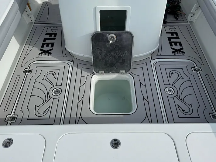  Yacht Photos Pics 2021 Yellowfin 26 Hybrid boat deck with Reflex flooring and open hatch.