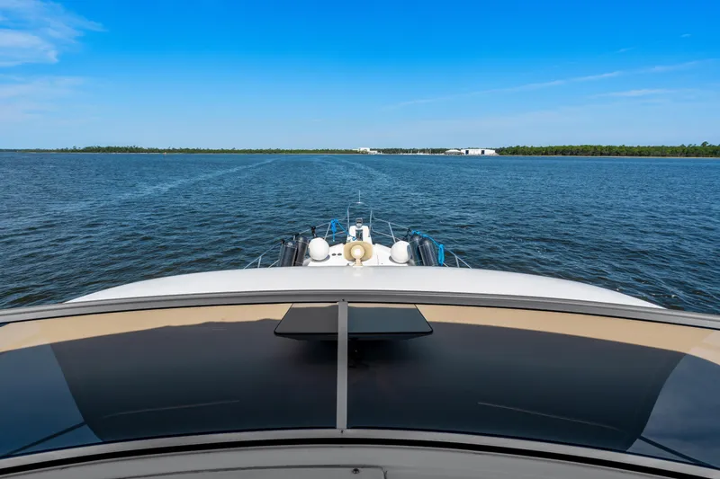 Trust Yacht Photos Pics 2007 Meridian 490 Pilothouse yacht cruising on open water under clear blue skies.