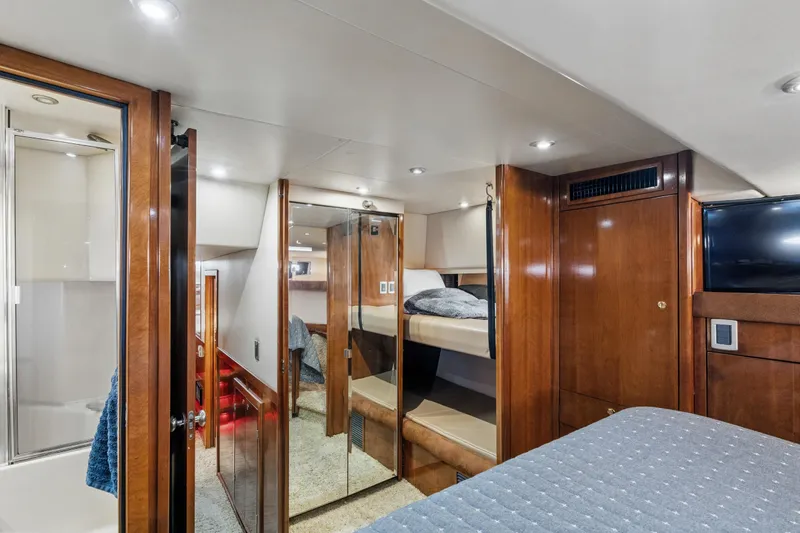 Trust Yacht Photos Pics Luxurious 2007 Meridian 490 Pilothouse interior with wood finishes and cozy sleeping area.