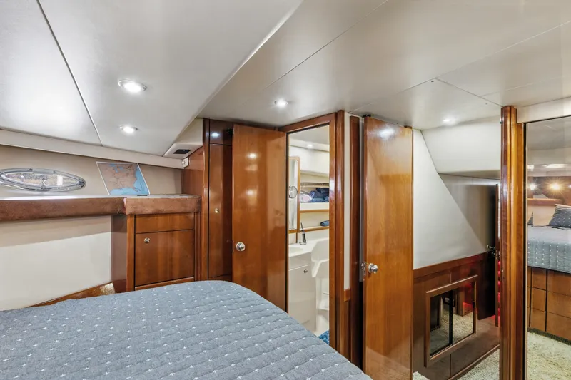 Trust Yacht Photos Pics Luxurious interior of 2007 Meridian 490 Pilothouse yacht cabin with wood finishes.