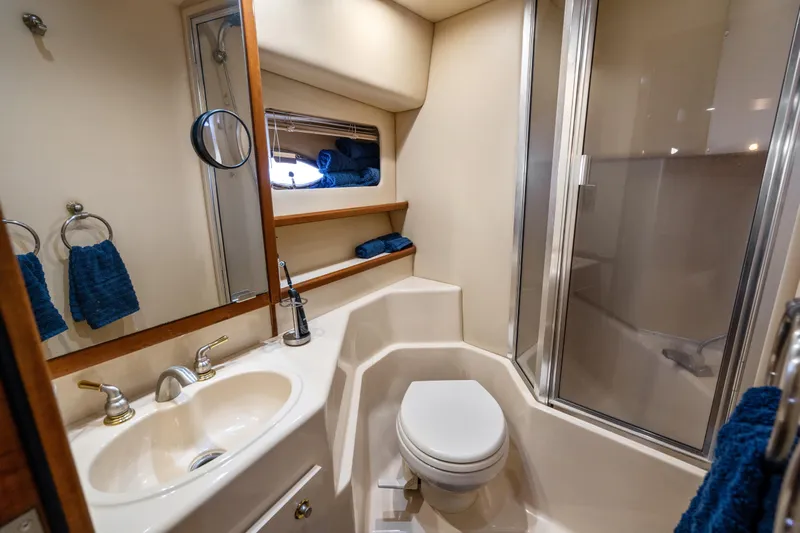 Trust Yacht Photos Pics Luxurious bathroom in 2007 Meridian 490 Pilothouse yacht with shower and sink.