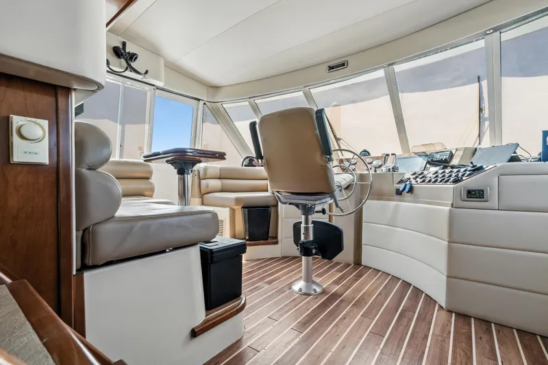 Trust Yacht Photos Pics Luxurious 2007 Meridian 490 Pilothouse interior with modern helm and seating.