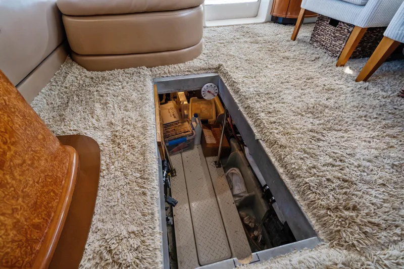 Trust Yacht Photos Pics 2007 Meridian 490 Pilothouse interior with open hatch revealing storage area.