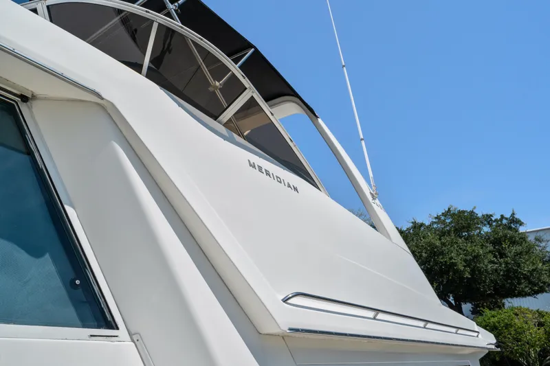 Trust Yacht Photos Pics 2007 Meridian 490 Pilothouse yacht, sleek design under clear blue sky.