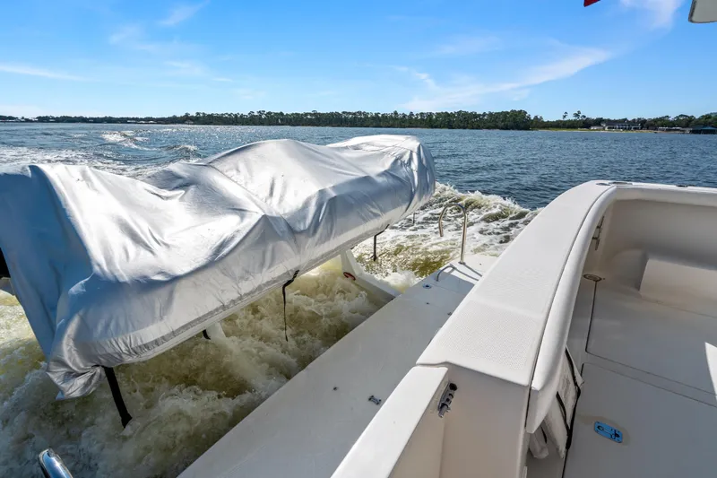 Trust Yacht Photos Pics 2007 Meridian 490 Pilothouse boat with covered equipment on deck, cruising on open water.