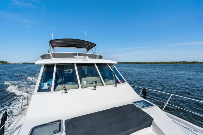 Trust Yacht Photos Pics 2007 Meridian 490 Pilothouse cruising on open water under clear blue skies.