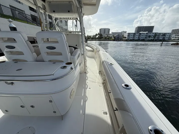  Yacht Photos Pics 2004 Boston Whaler 320 Outrage boat interior with seating and water view.