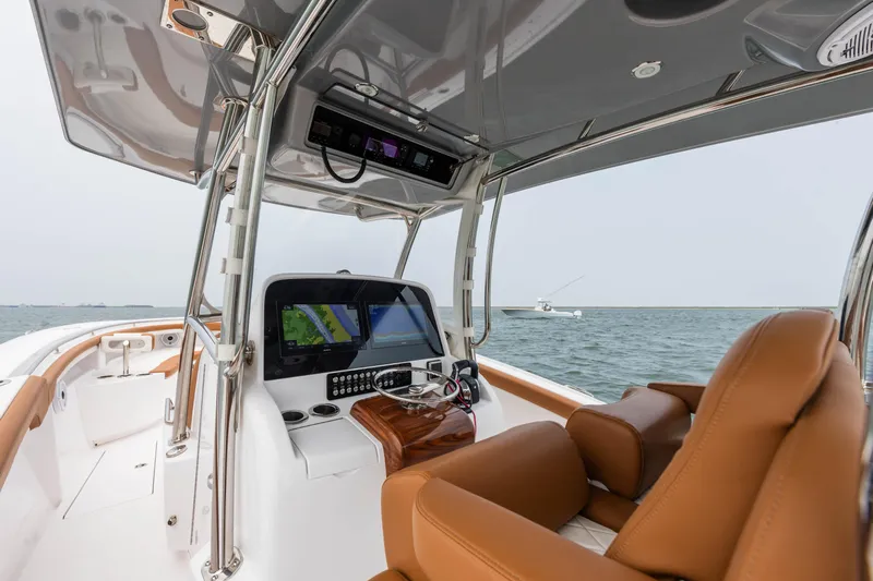  Yacht Photos Pics 2022 Mag Bay 33cc boat interior with advanced navigation system and leather seats.