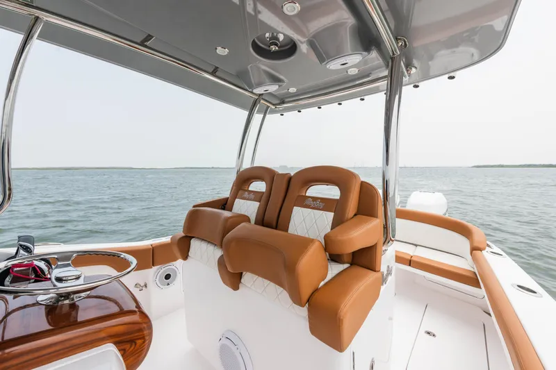  Yacht Photos Pics 2022 Mag Bay 33cc boat interior with luxurious seating and ocean view.