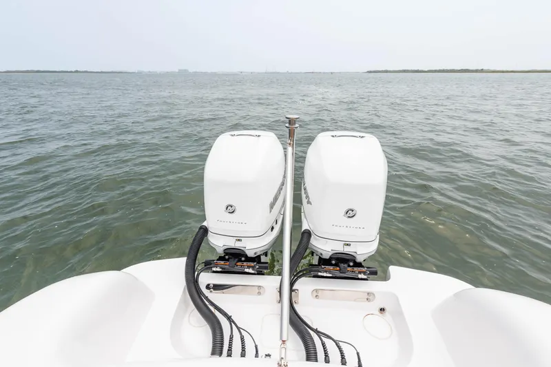  Yacht Photos Pics 2022 Mag Bay 33cc boat with twin outboard engines on open water.