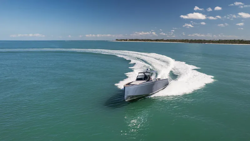  Yacht Photos Pics 2025 Pardo Yachts P43 cruising on open water under a clear blue sky.