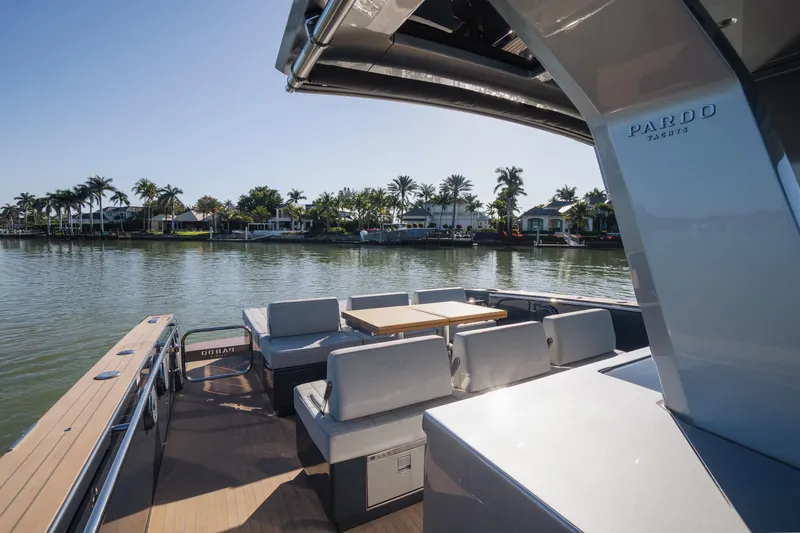  Yacht Photos Pics 2025 Pardo Yachts P43 on serene water, featuring luxurious seating and sleek design.