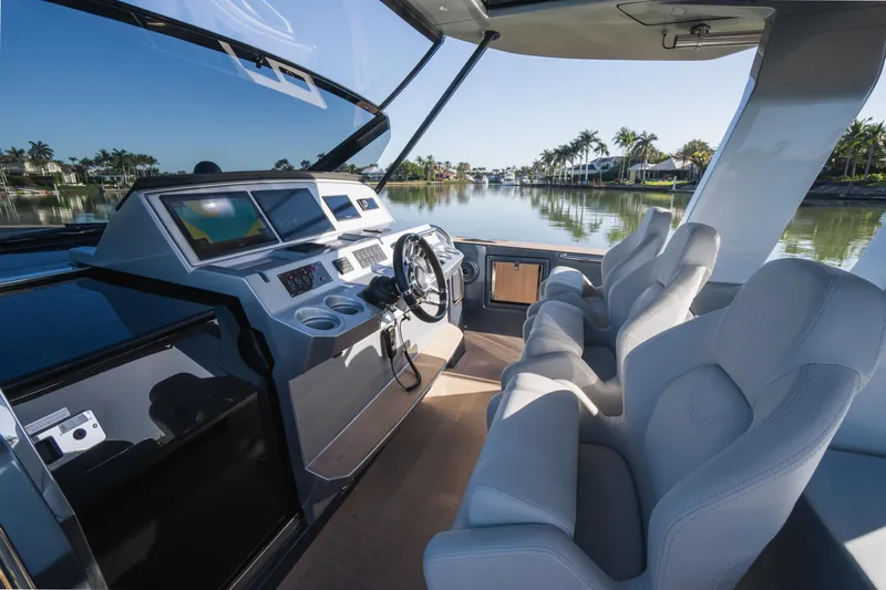  Yacht Photos Pics Interior of 2025 Pardo Yachts P43, featuring sleek helm and luxurious seating.