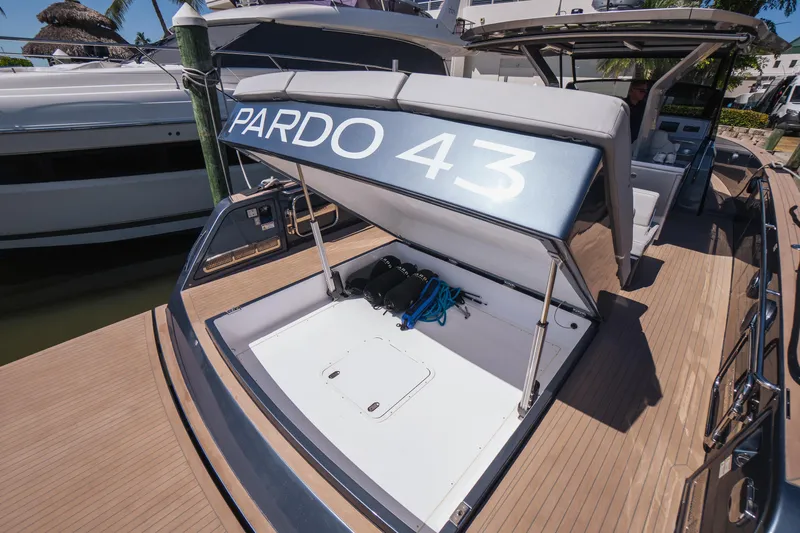  Yacht Photos Pics 2025 Pardo Yachts P43 luxury yacht with open storage compartment at dock.