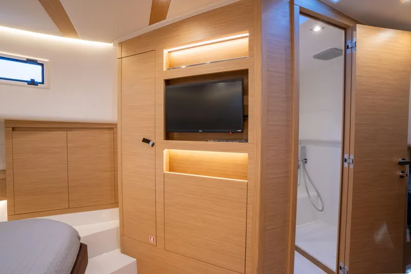  Yacht Photos Pics Luxurious interior of 2025 Pardo Yachts P43 with modern wood finish and built-in TV.