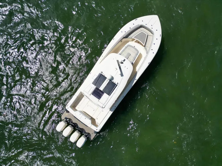  Yacht Photos Pics Aerial view of 2021 Scout 380 LXF boat on green water.