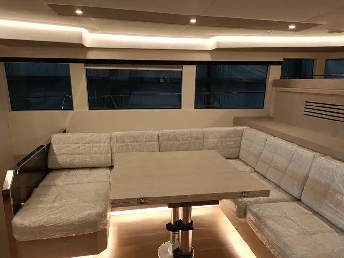  Yacht Photos Pics Luxurious interior of 2022 Mazarin 55 Catamaran with modern seating and ambient lighting.