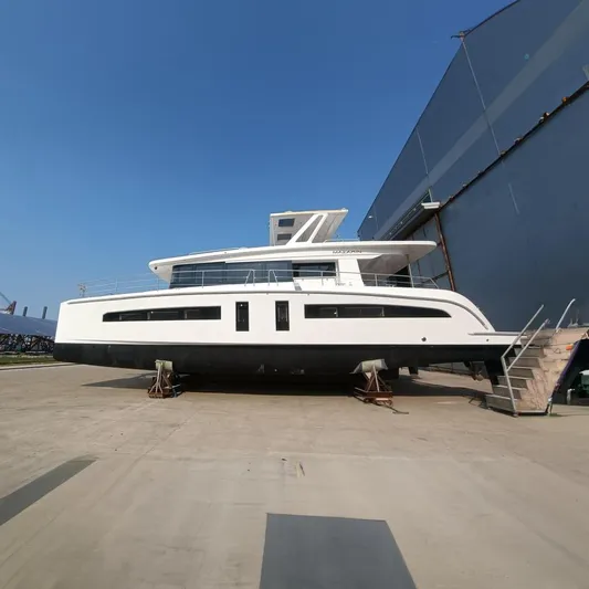  Yacht Photos Pics 2022 Mazarin 55 Catamaran Diesel on dry dock, showcasing sleek design and modern features.