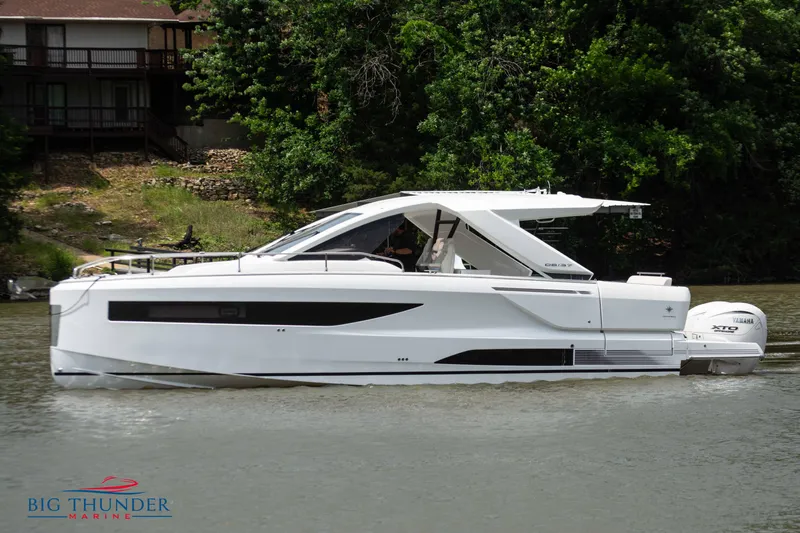  Yacht Photos Pics 2024 Jeanneau DB/37 OB luxury motorboat on a calm river.