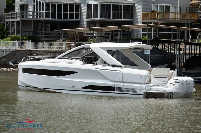  Yacht Photos Pics 2024 Jeanneau DB/37 OB boat docked near waterfront homes.