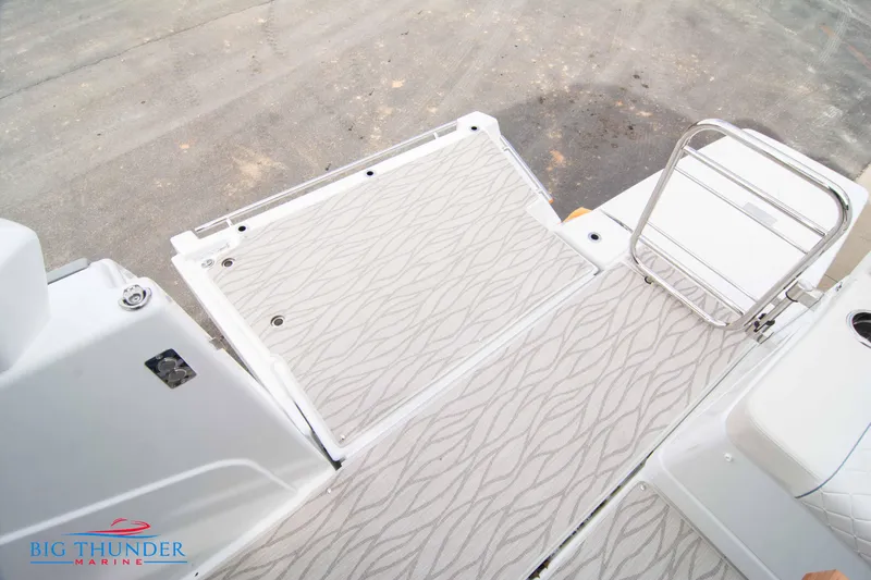  Yacht Photos Pics 2024 Jeanneau DB/37 OB boat deck with patterned flooring and ladder.