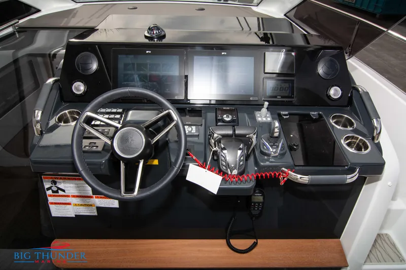  Yacht Photos Pics Helm of 2024 Jeanneau DB/37 OB with advanced navigation controls and dual screens.