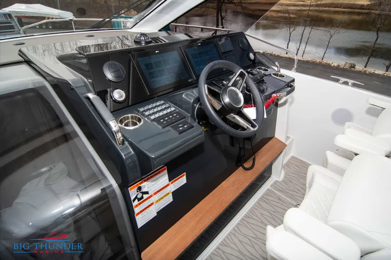  Yacht Photos Pics 2024 Jeanneau DB/37 OB boat helm with modern controls and dual seats.