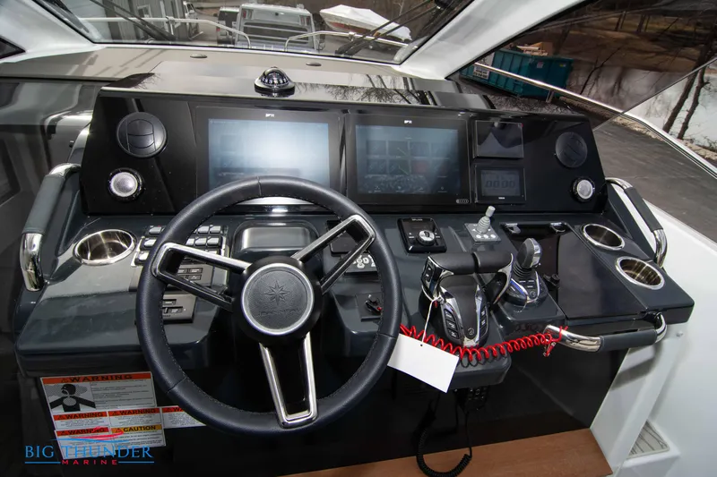  Yacht Photos Pics 2024 Jeanneau DB/37 OB helm with modern controls and touchscreen displays.