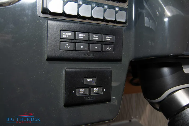  Yacht Photos Pics Control panel of 2024 Jeanneau DB/37 OB boat with various buttons and switches.