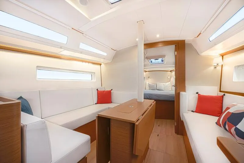  Yacht Photos Pics Luxurious interior of 2025 Jeanneau 380 yacht with modern seating and elegant design.