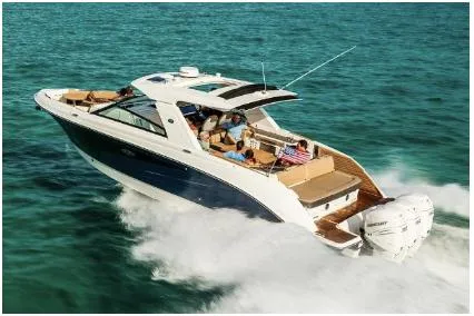  Yacht Photos Pics 2021 Sea Ray SLX 400 Outboard cruising on clear blue water.