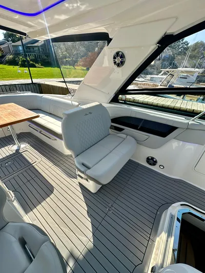  Yacht Photos Pics 2021 Sea Ray SLX 400 Outboard interior with luxurious seating and sleek design.