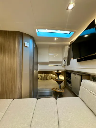  Yacht Photos Pics 2021 Sea Ray SLX 400 Outboard interior with modern design, skylight, and entertainment area.