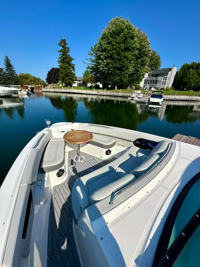  Yacht Photos Pics 2021 Sea Ray SLX 400 Outboard docked by a serene waterfront property.